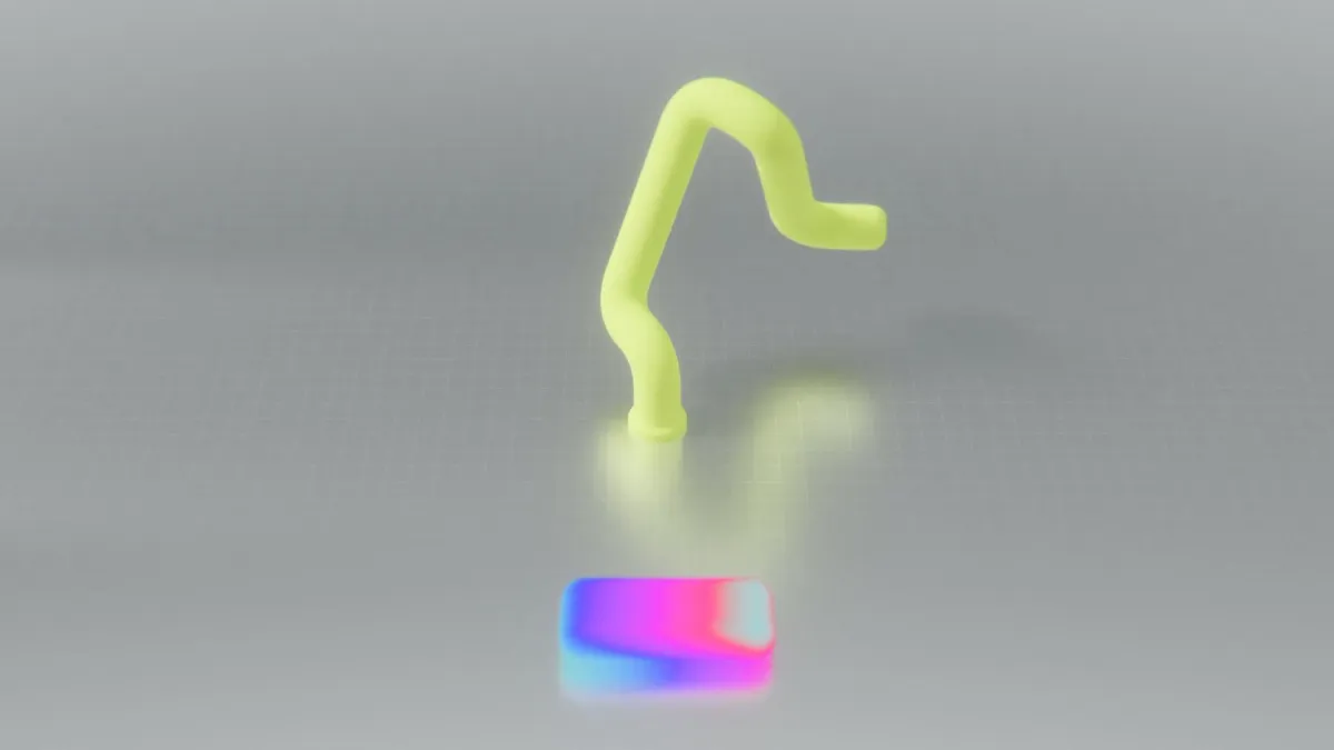 Bent yellow tube shape above a colourful block, symbolising a user intention
